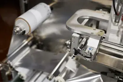 Close-up of a form fill seal machine head feeding packaging film
